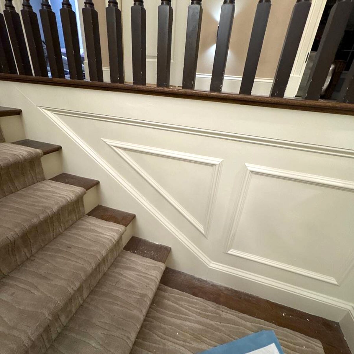 Wainscoting and millwork along a staircase