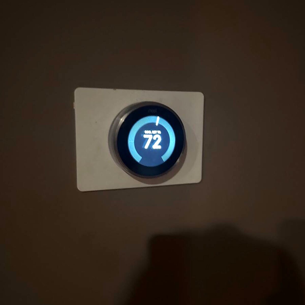 Newly installed smart thermostat on the wall